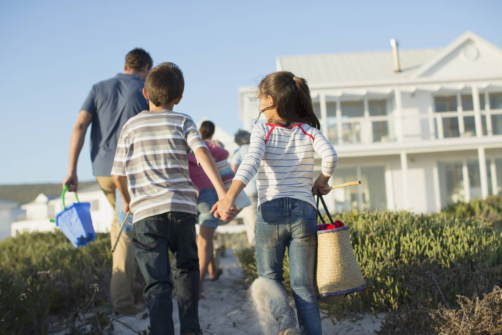 family at beach and time-sharing over the summer